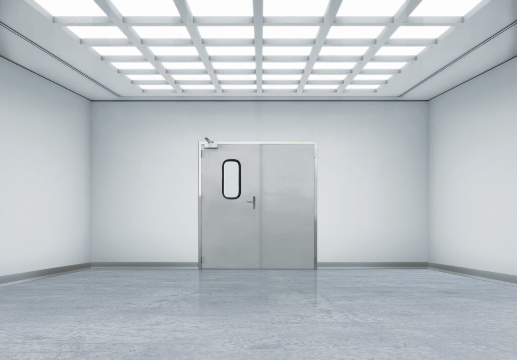 Minimal white room with grid ceiling lights and stainless double door