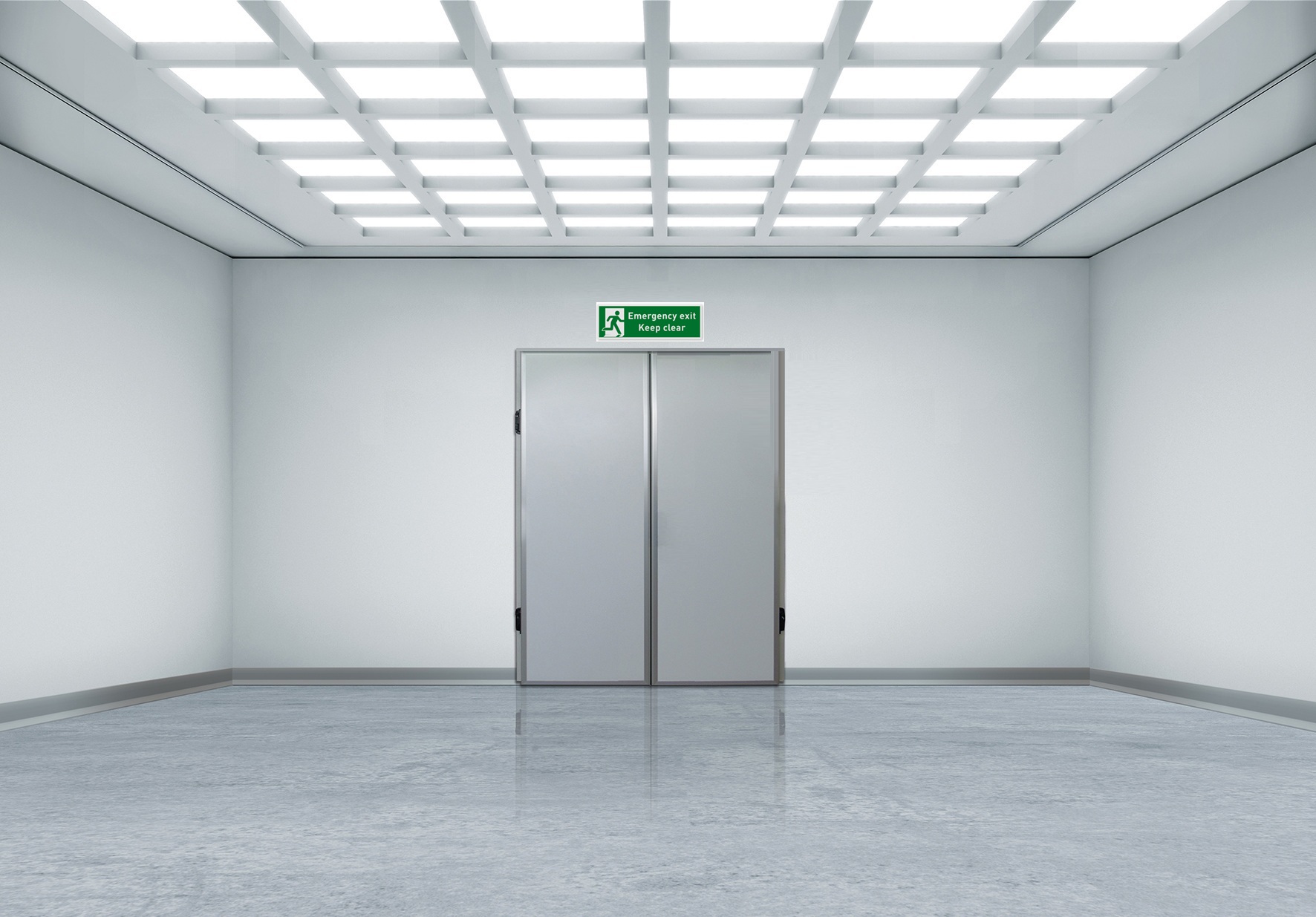 Empty white corridor with double gray doors and an emergency exit sign.